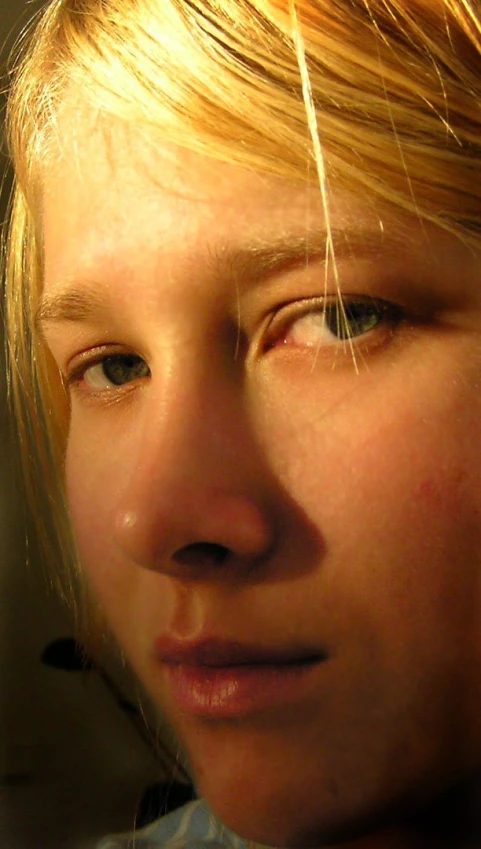 a blond girl with hair blowing in the wind