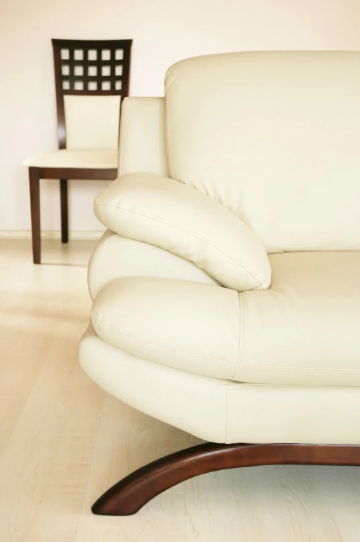 a close up of a modern white leather couch