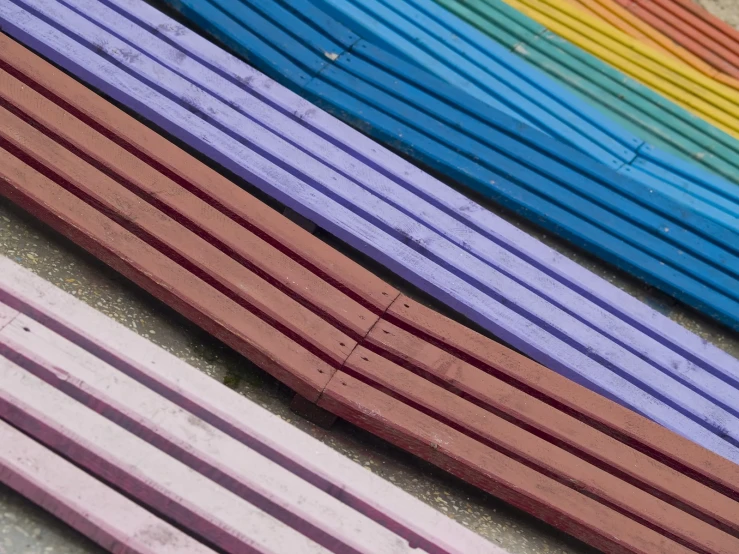 a close up view of four colorful wooden slats