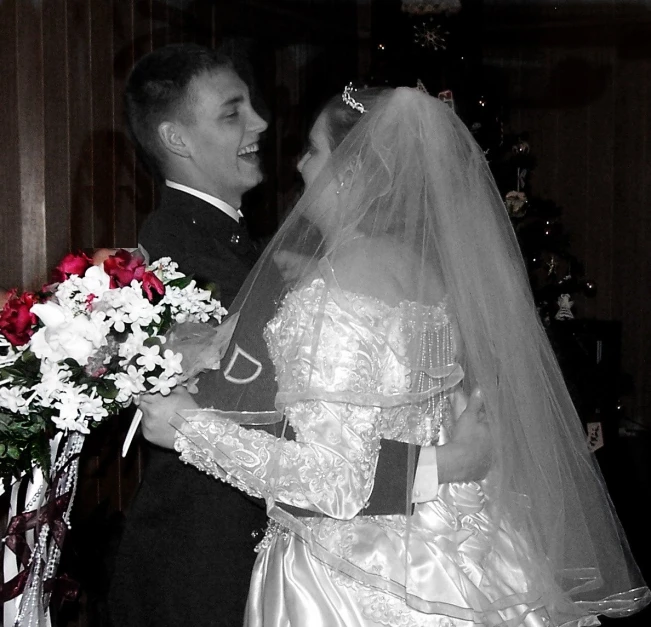 an older man is holding the bride's bouquet