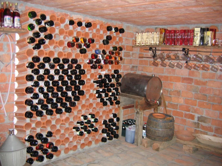 a room with a red brick wall covered in wine bottle caps