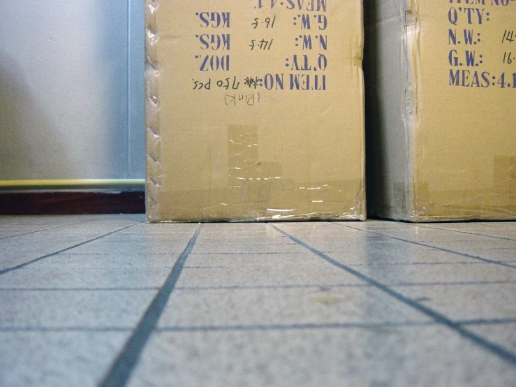 two cardboard boxes side by side in a room