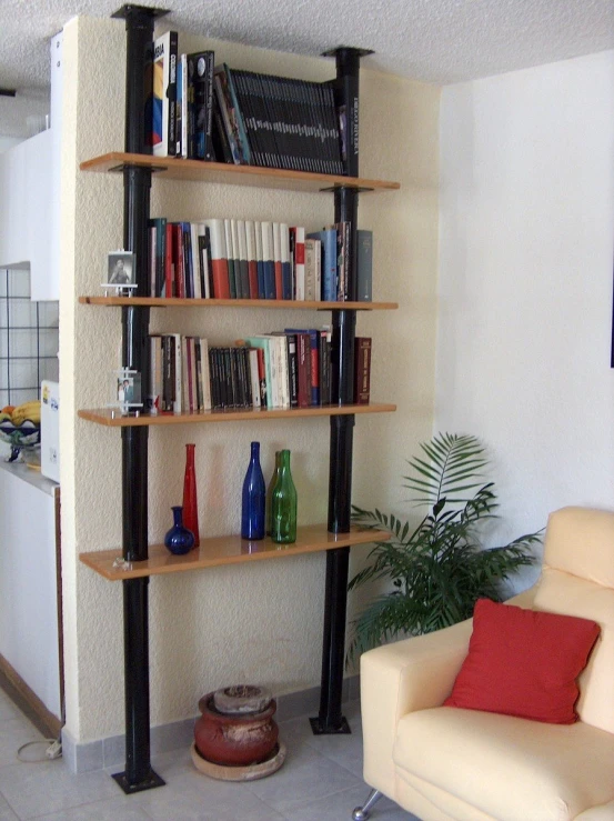 an assortment of bookshelves in a living room