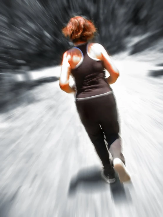 a woman running through a snow covered forest