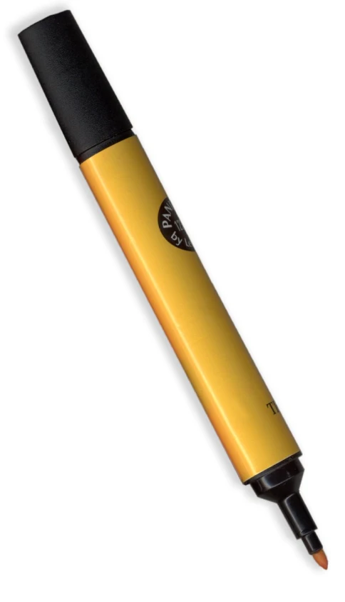 a yellow and black pen sitting on top of a white surface