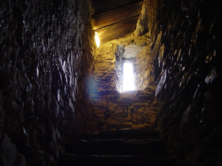 sunlight coming through the window of a narrow tunnel