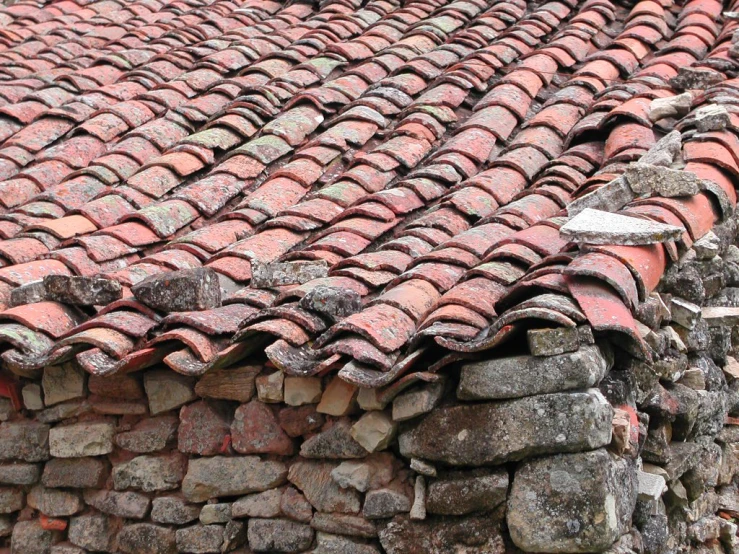 a group of stone tiles roofing and some debris