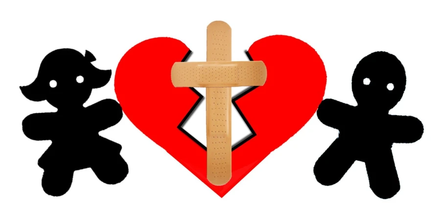 wooden pegs with a broken heart, people, and a cross