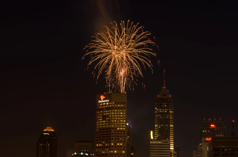 fireworks in the sky above a city at night