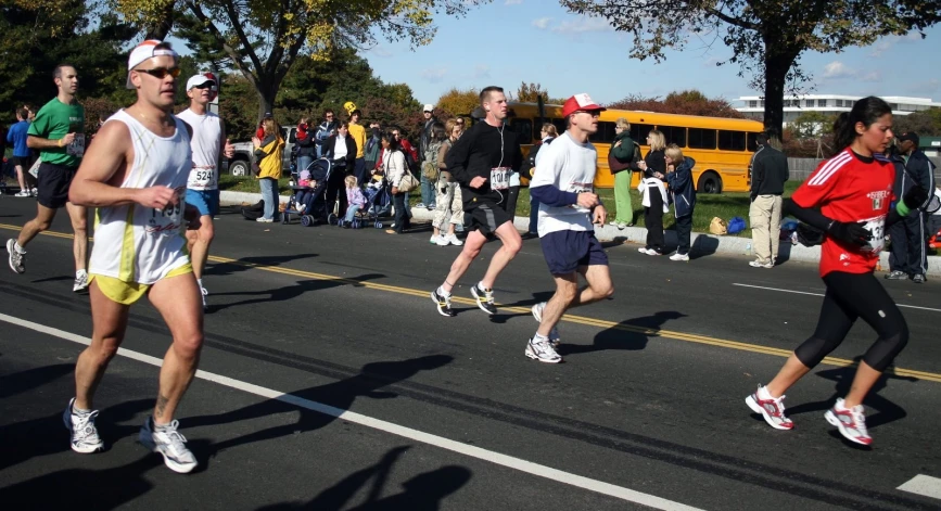 people running in a marathon wearing different colors