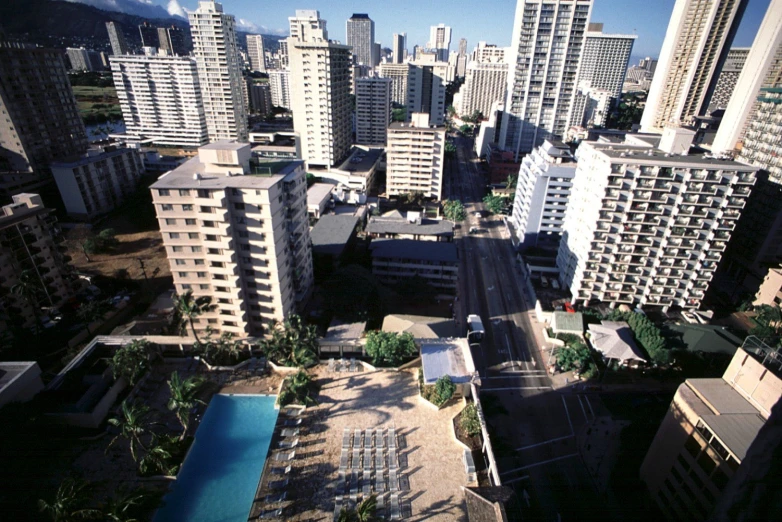 a cityscape with several tall buildings with a pool