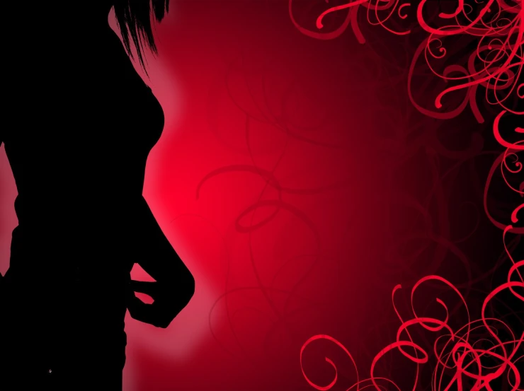 silhouette with hair blown up and the background is red