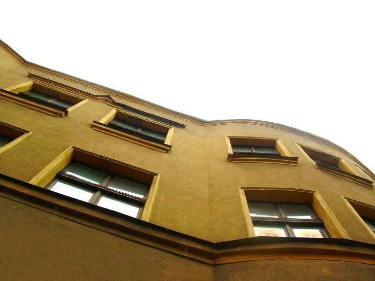 an angled picture of a building with several windows