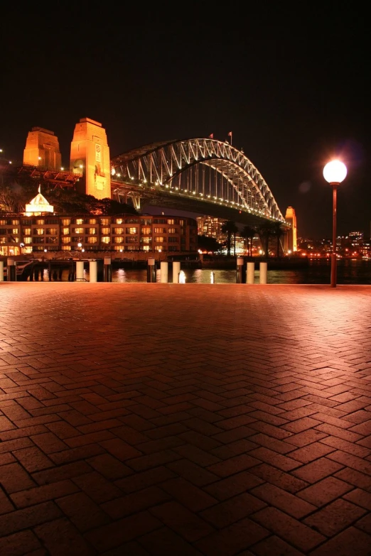 lit up view of the sydney harbour and bridge