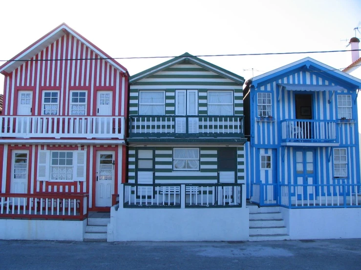 the houses in front of the street have multicolored windows