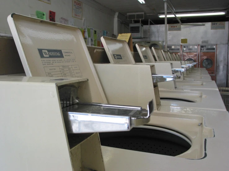 row of dirty washers in a building