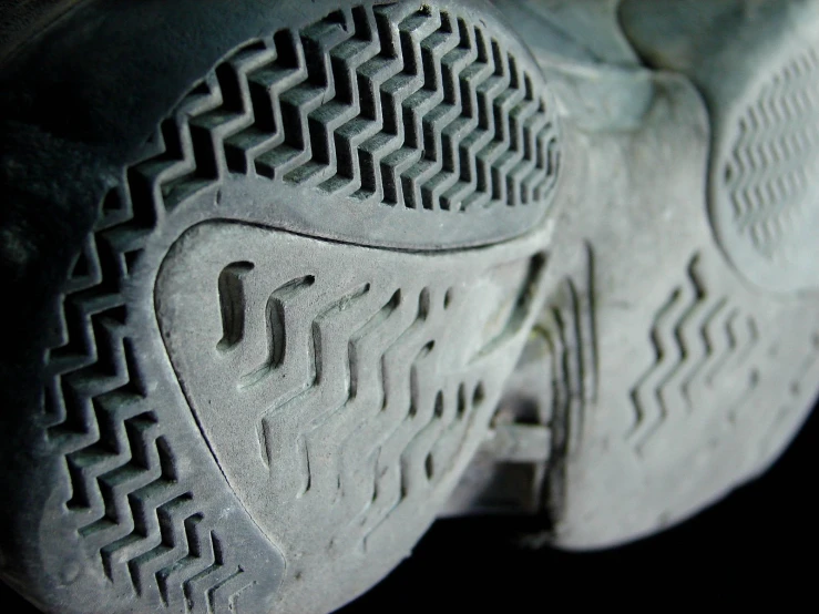 close up of a pair of nikes shoes with sole markings