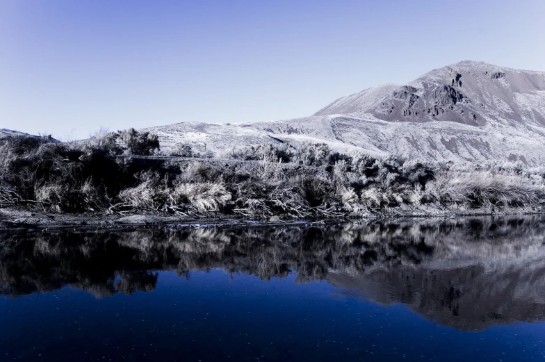 the mountain is covered in white and snow