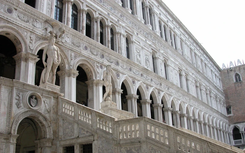 some white building with lots of windows and architecture