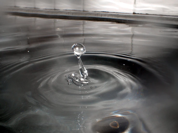 a sink that has some water on it