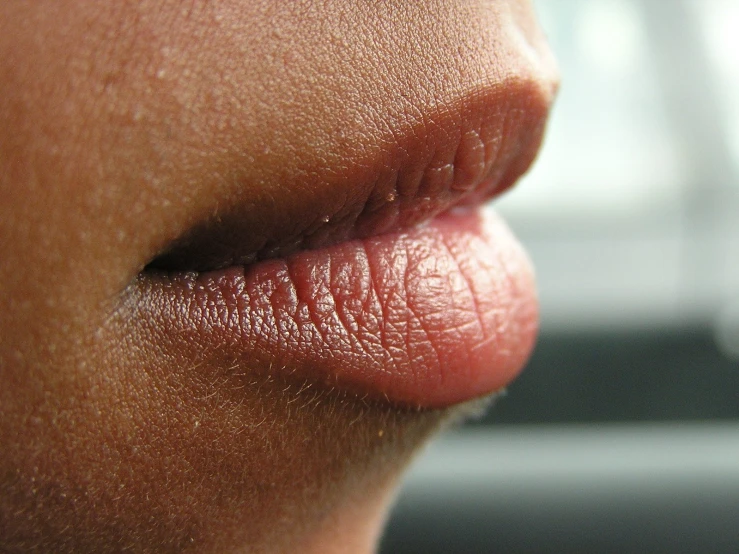 the top part of a person's lips with it's tongue