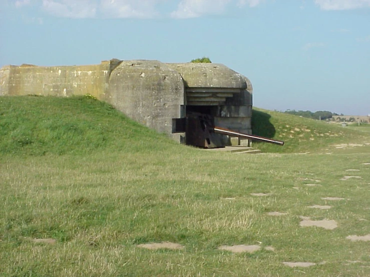 a large long wall in a very green field