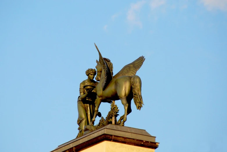 a statue of a winged man on a horse