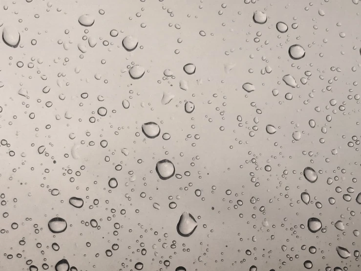 water drops on the glass and in front of the sky