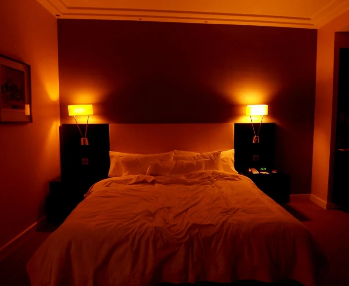 an empty bed in a dimly lit room