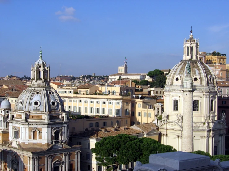 an old church tower towering over a city