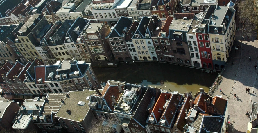 a city with many windows and red and blue rooftops