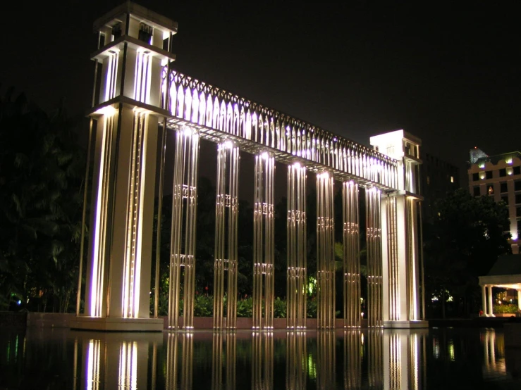 a large fountain surrounded by tall buildings