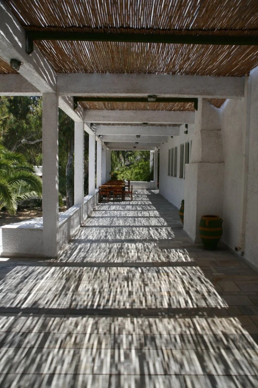 the shadow of a patio on a sunny day