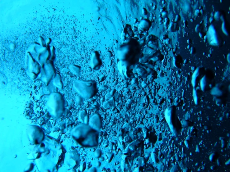 some water and rocks in a blue color