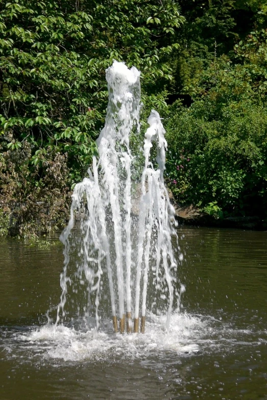 the back side of a fountain is spewing water
