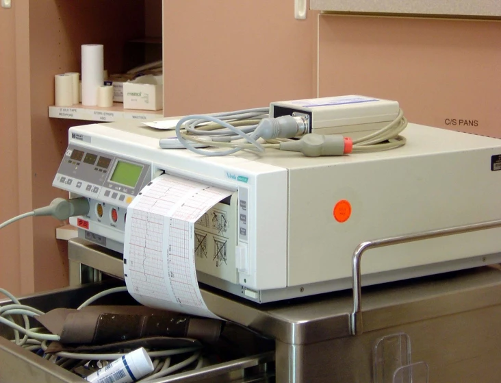 electronic equipment with wires and other accessories is set up on the counter
