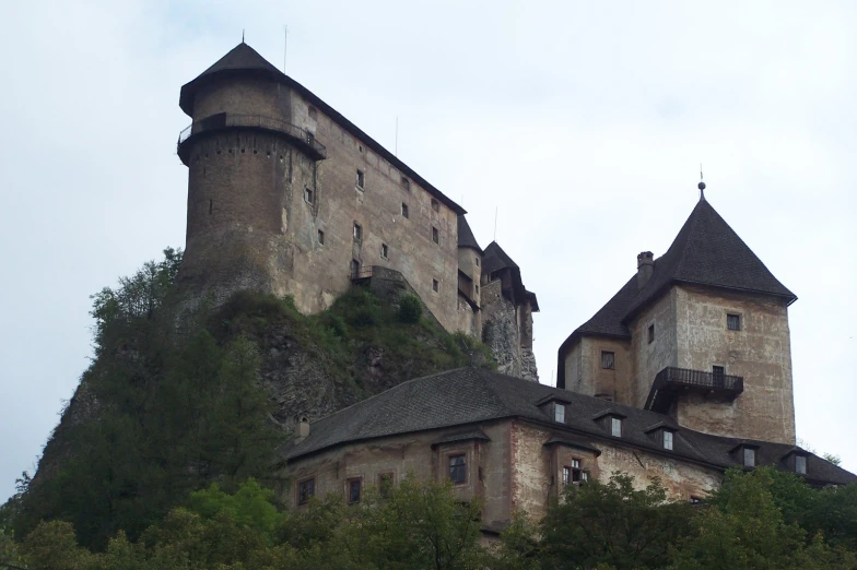 the castle is sitting on top of a mountain