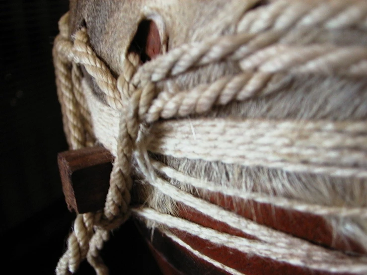 a ball of rope is connected to a wooden fence