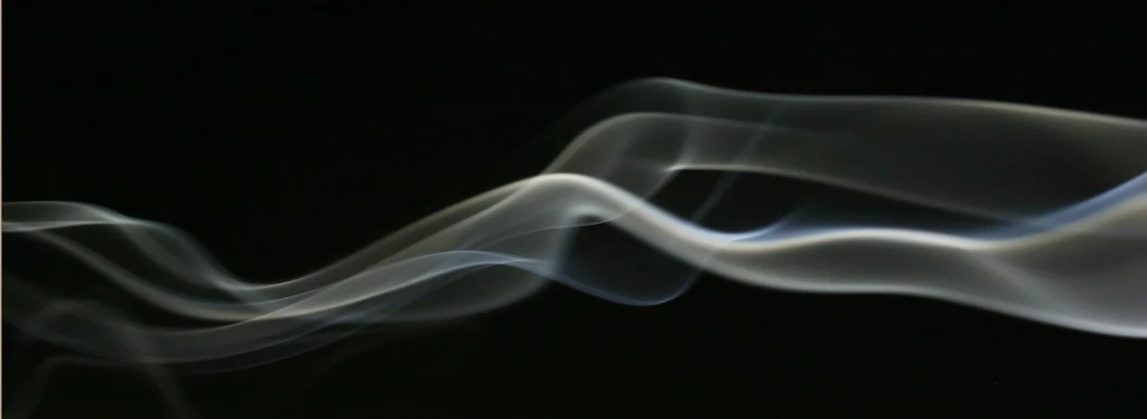 smoke against a black background showing the thinest lines of the smoke