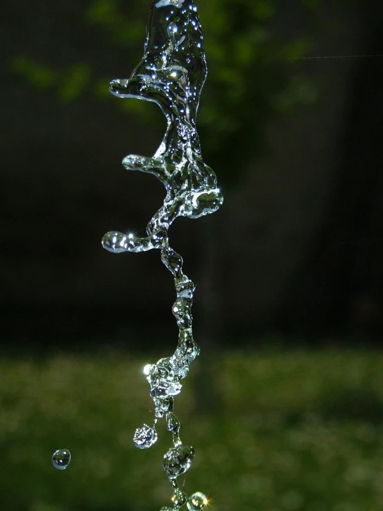 a close up of water in a green field
