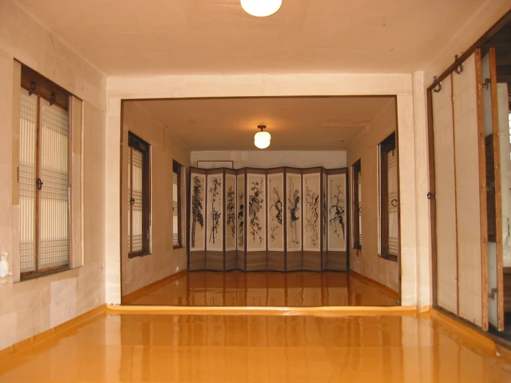 an open hallway that is covered in asian artwork