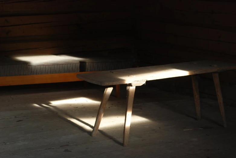 a wooden table in the shadows and light