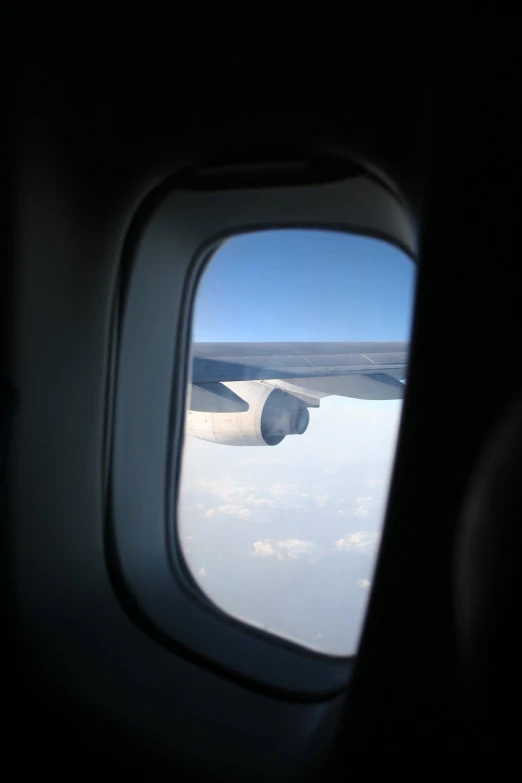 a view of the wing of a plane in flight