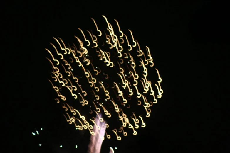 a lit up flower made from multiple circular circles in the air