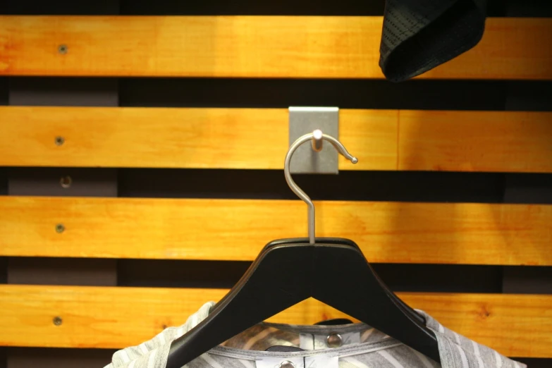 a close up image of a tie hanger on a shirt