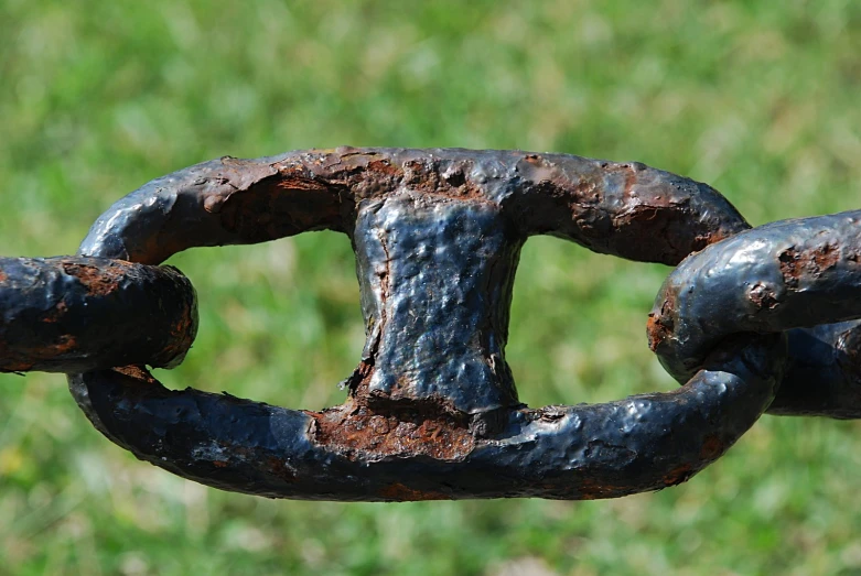 an old rusty metal chain that is being pographed