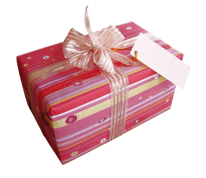 a pink wrapped gift with a bow and label on the top