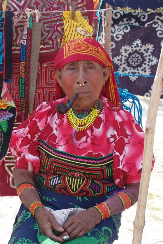 a woman dressed up with bright colorful clothes