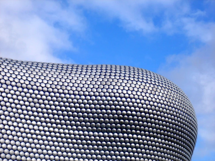 building designed like a sphere with a sky in the background