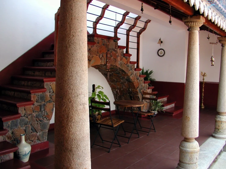 an outside area with many columns and tables